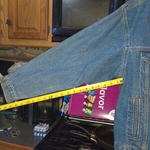 Men mid sized Carhartt denim jacket with a motorcycle dry run patch